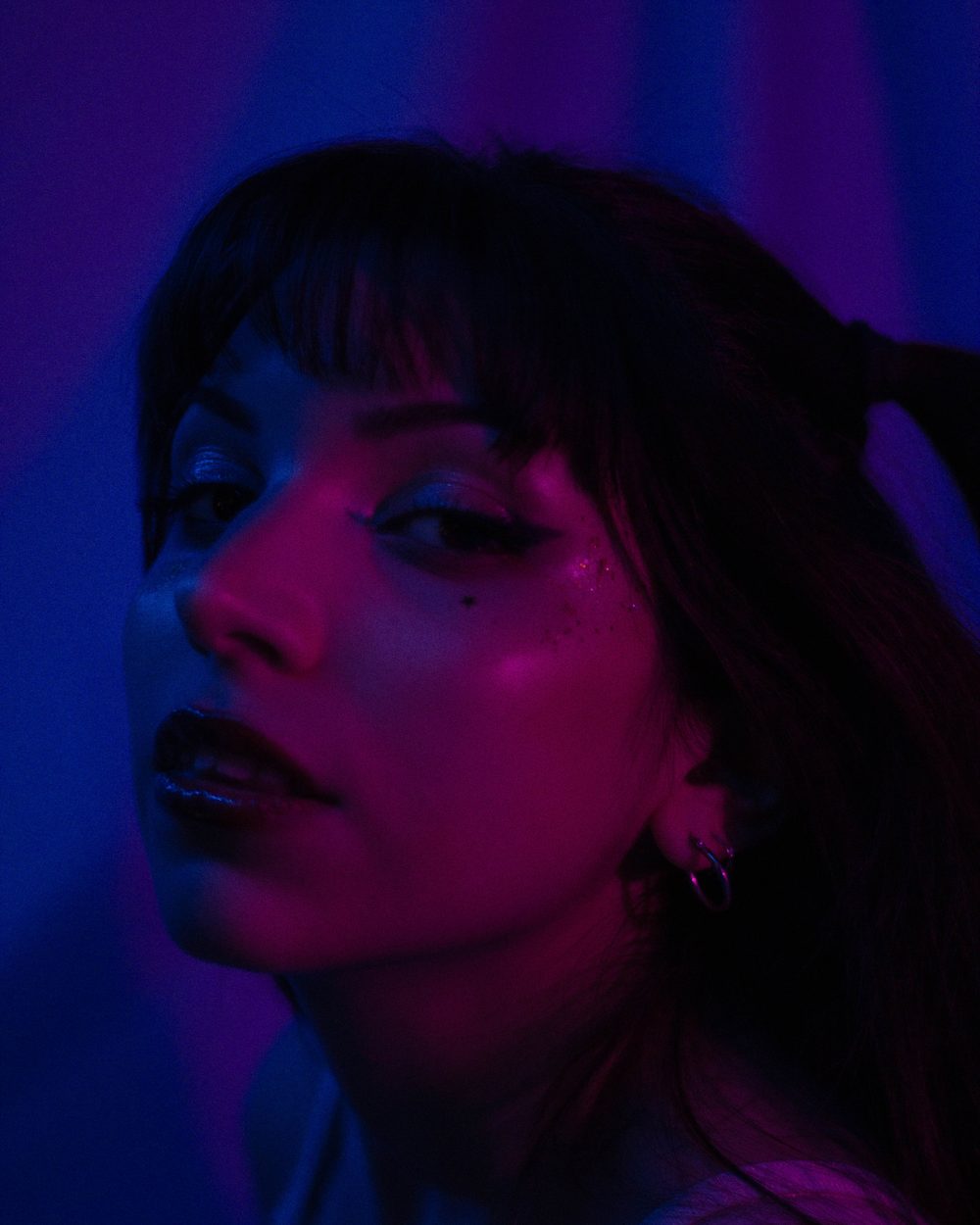 Neon-lit editorial portrait
